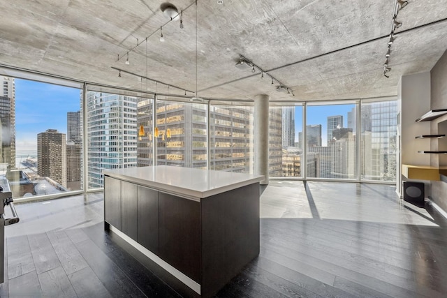 office featuring plenty of natural light, a view of city, and a wall of windows