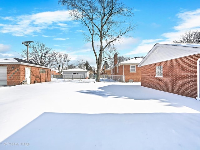 view of yard layered in snow