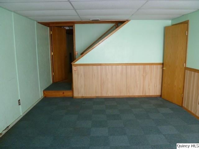 empty room featuring a paneled ceiling