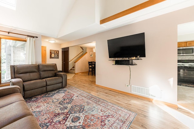 7914 S Garfield Ave, Burr Ridge, IL 60527 - living room with stairway, wood finished floors, and high vaulted ceiling