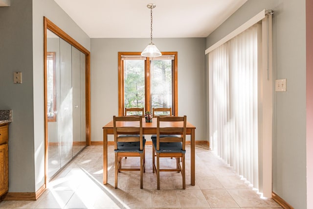 7914 S Garfield Ave, Burr Ridge, IL 60527 - dining room with baseboards and light tile patterned flooring