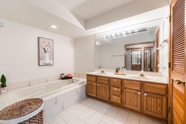 7914 S Garfield Ave, Burr Ridge, IL 60527 - bathroom featuring tile patterned flooring, double vanity, a bath, and recessed lighting