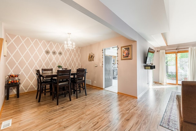 7914 S Garfield Ave, Burr Ridge, IL 60527 - dining space with a chandelier and light wood finished floors