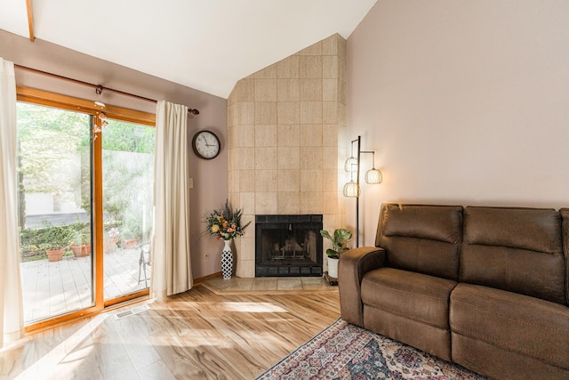 7914 S Garfield Ave, Burr Ridge, IL 60527 - living room featuring lofted ceiling, a fireplace, and wood finished floors