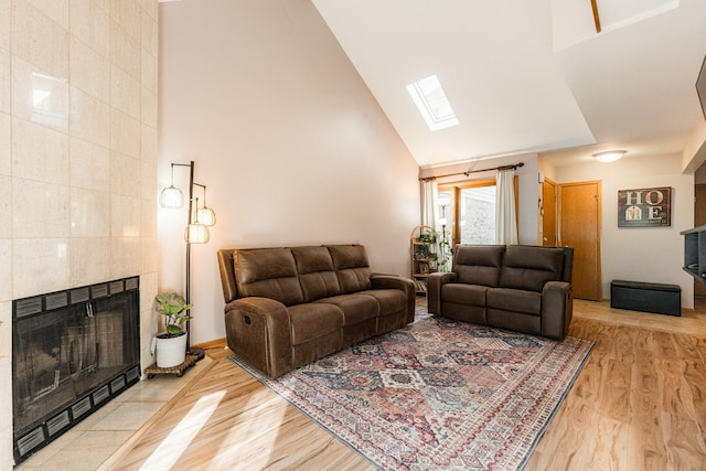 7914 S Garfield Ave, Burr Ridge, IL 60527 - living room with a skylight, high vaulted ceiling, wood finished floors, and a fireplace