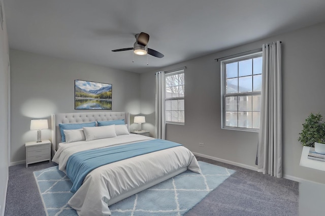 bedroom featuring ceiling fan and dark colored carpet