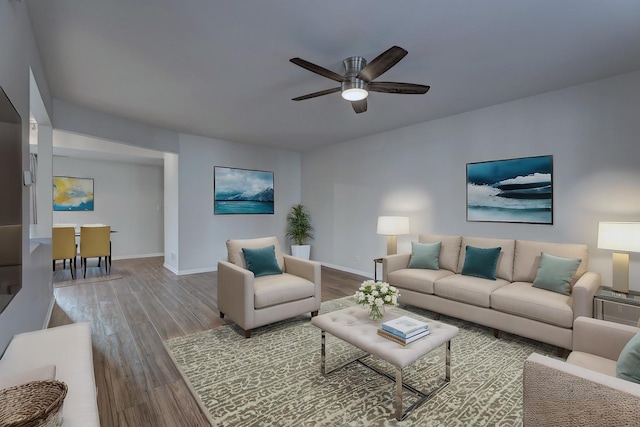 living room with hardwood / wood-style flooring and ceiling fan