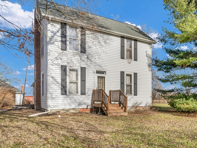 colonial inspired home with a front yard