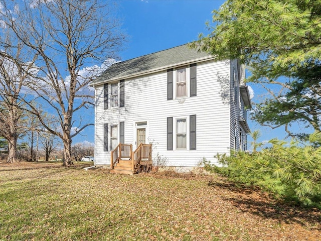 colonial home with a front yard