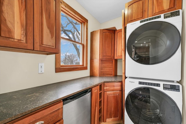 laundry area with stacked washer / dryer