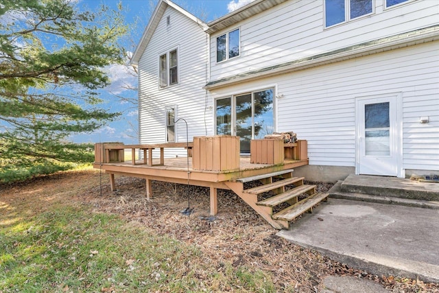 rear view of house with a wooden deck