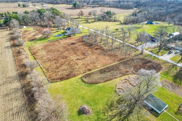 birds eye view of property featuring a rural view