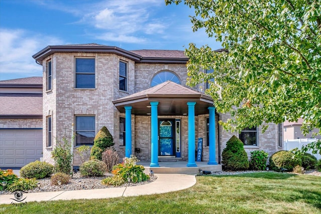 view of front facade with a front lawn and a porch