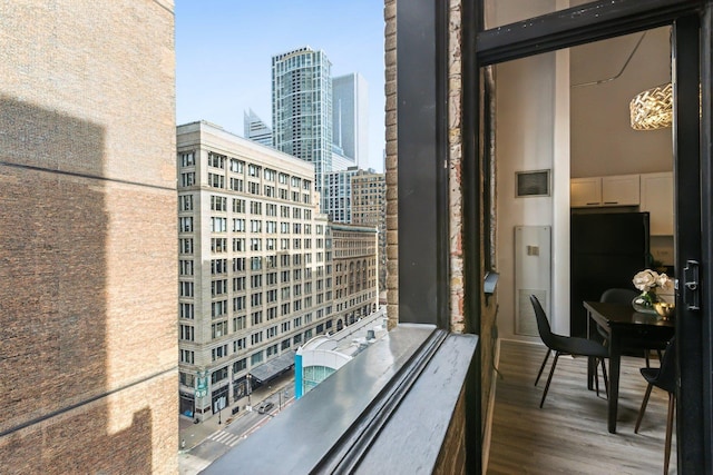 balcony featuring a view of city and visible vents