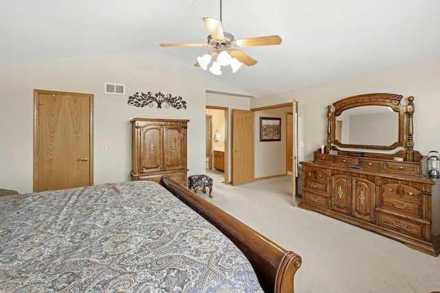 bedroom featuring vaulted ceiling, light colored carpet, and ceiling fan