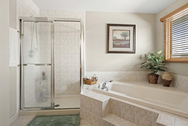 bathroom featuring separate shower and tub and tile patterned flooring