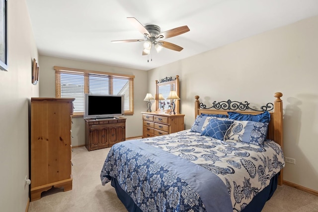 bedroom with light colored carpet and ceiling fan