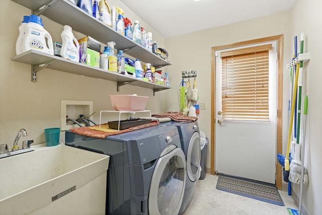 washroom with sink and washing machine and dryer