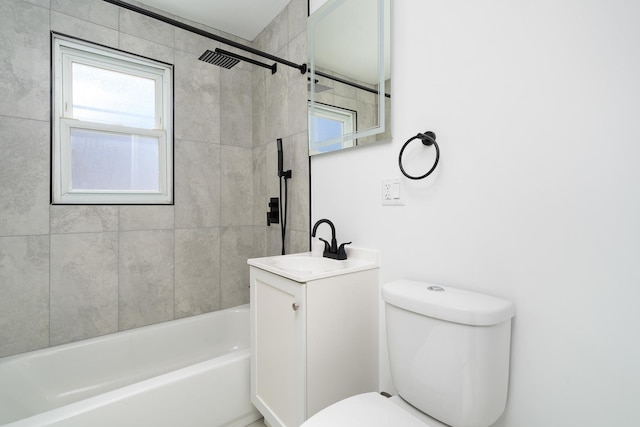 bathroom with toilet,  shower combination, and vanity