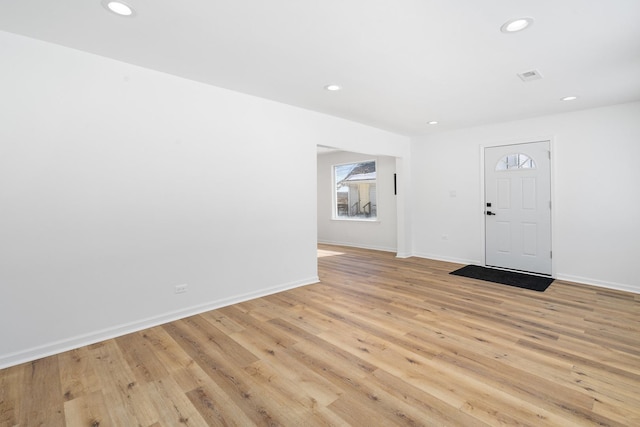 entryway with light wood-style flooring, baseboards, and recessed lighting