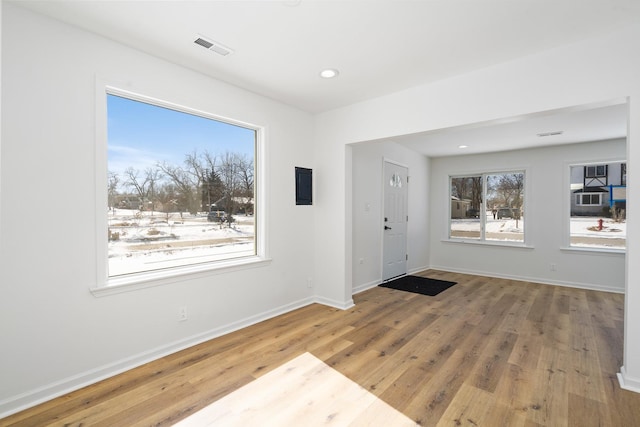 entryway with recessed lighting, wood finished floors, visible vents, and baseboards