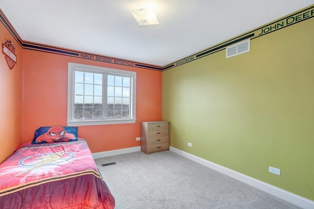 bedroom with carpet, crown molding, visible vents, and baseboards