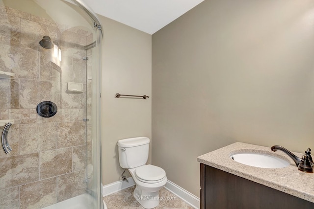 full bath featuring tile patterned flooring, toilet, vanity, baseboards, and a shower stall