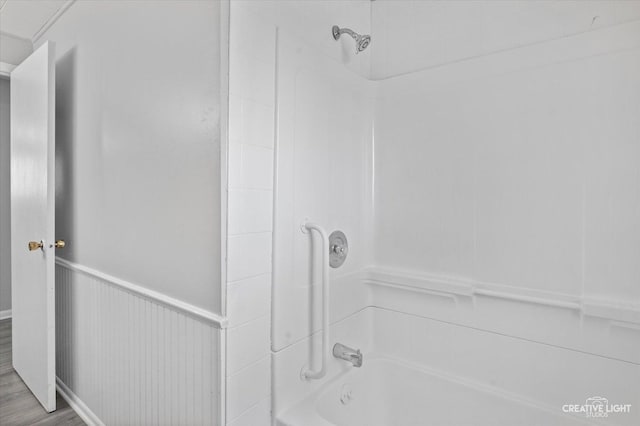 bathroom featuring hardwood / wood-style floors and shower / bathtub combination