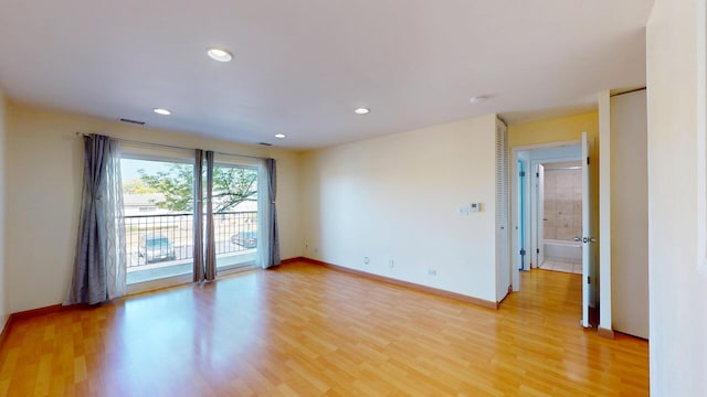 8640 Waukegan Rd Unit 227, Morton Grove, IL 60053 - empty room with light wood-style floors, recessed lighting, and baseboards
