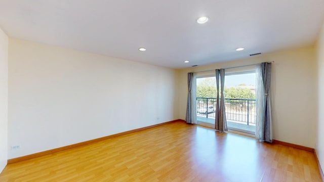 8640 Waukegan Rd Unit 227, Morton Grove, IL 60053 - unfurnished room with light wood-type flooring, baseboards, and recessed lighting
