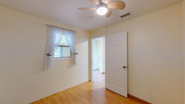 8640 Waukegan Rd Unit 227, Morton Grove, IL 60053 - spare room with light wood-type flooring and a ceiling fan