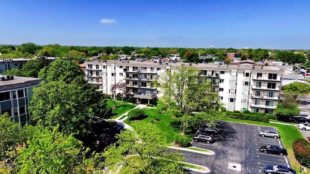 8640 Waukegan Rd Unit 227, Morton Grove, IL 60053 - view of apartment building / complex featuring uncovered parking