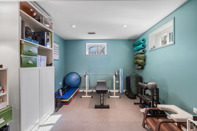 workout room featuring recessed lighting and visible vents