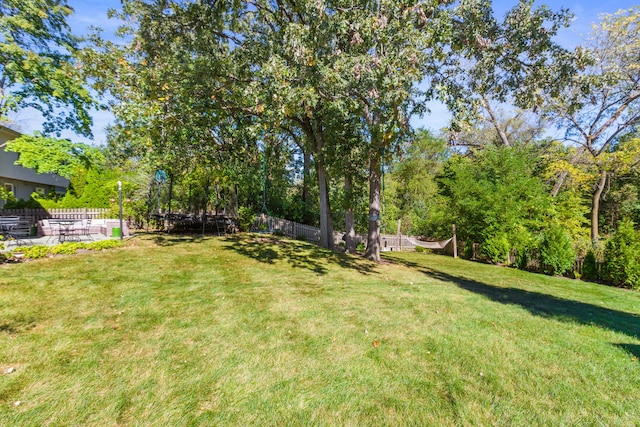 view of yard featuring a patio area and fence