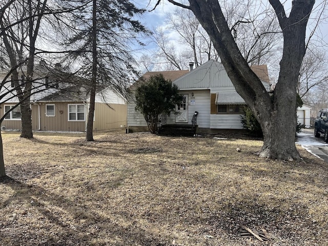 exterior space with a shingled roof