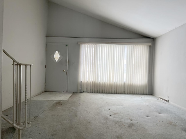 foyer entrance featuring lofted ceiling