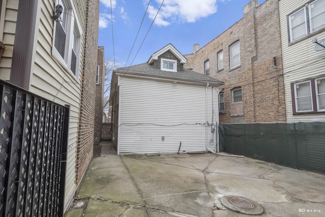 garage with fence