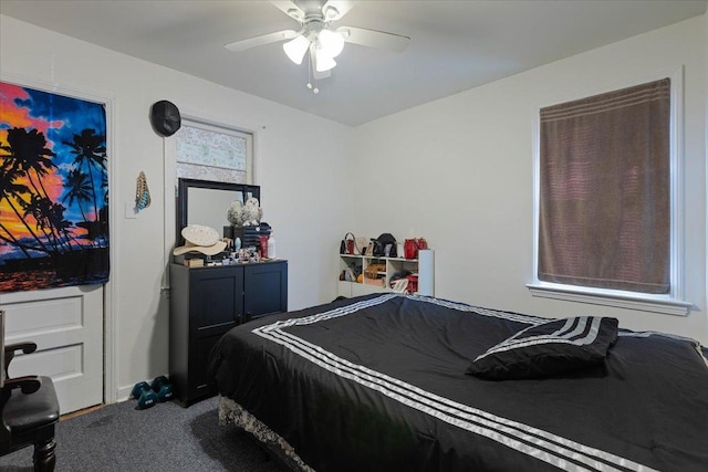 bedroom featuring ceiling fan and carpet floors