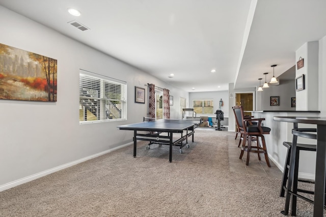 rec room featuring carpet flooring and a wealth of natural light