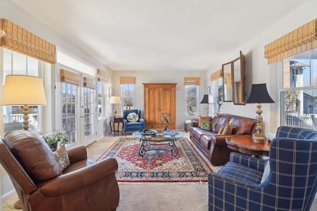 living area with french doors and baseboards