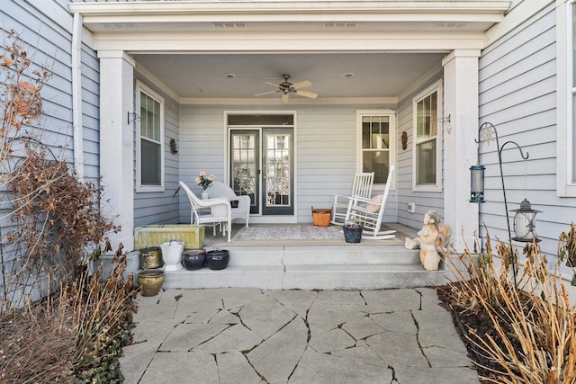 view of patio with a porch, visible vents, and ceiling fan