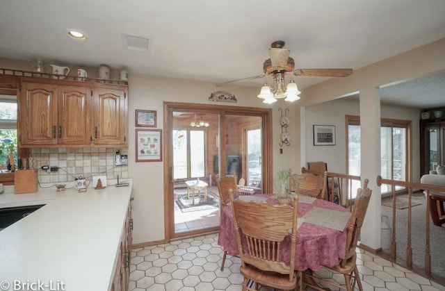 dining space featuring recessed lighting, a healthy amount of sunlight, and visible vents