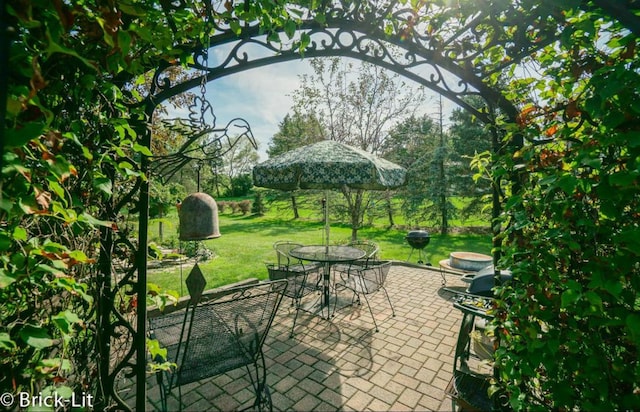 surrounding community with a patio and a lawn