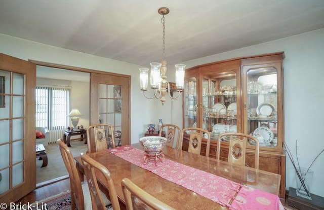 dining area with a notable chandelier