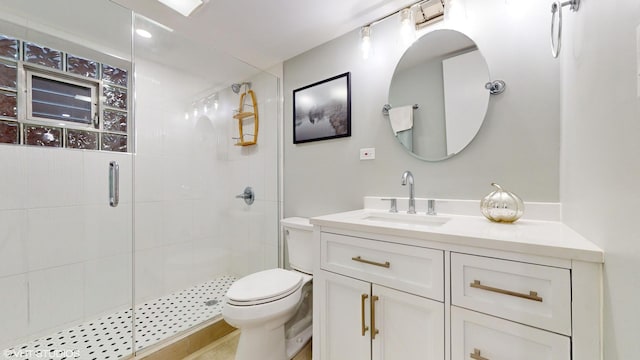 full bath featuring a shower stall, toilet, and vanity