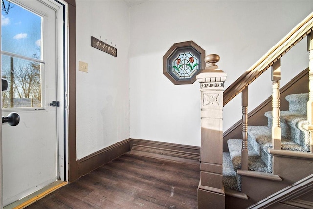 interior space featuring stairway, baseboards, and wood finished floors