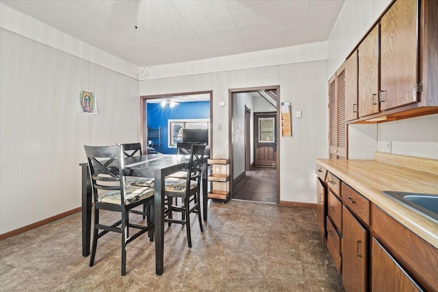 dining space featuring baseboards