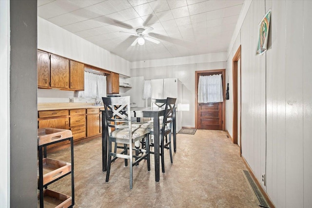 dining area featuring ceiling fan and visible vents