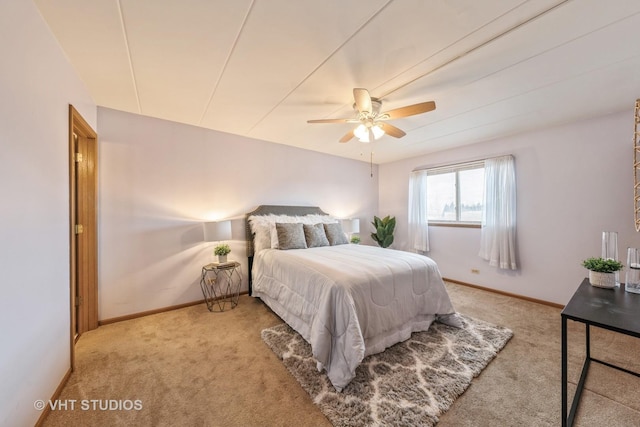 bedroom featuring carpet, baseboards, and a ceiling fan