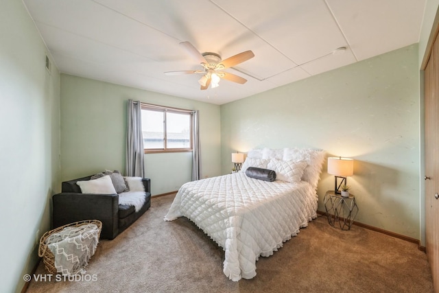 bedroom with ceiling fan, carpet floors, visible vents, and baseboards